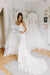 Bride holds 'I Said Yes' sign at the Wedding Shoppe