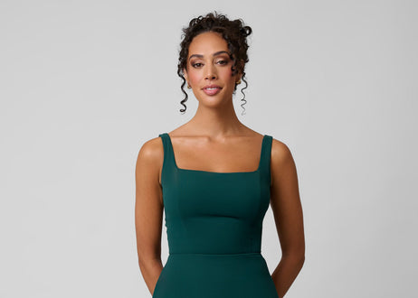 Model Wears Kennedy Blue Platinum Jay in Forest Green